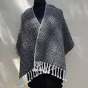 Black and white handwoven shawl.