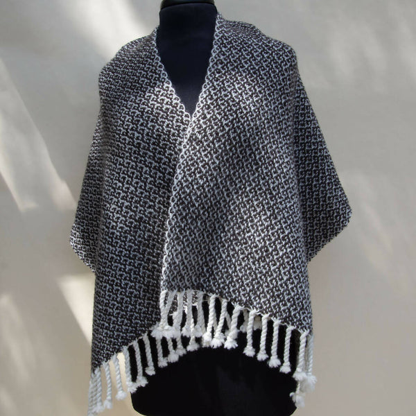 Black and white handwoven shawl.